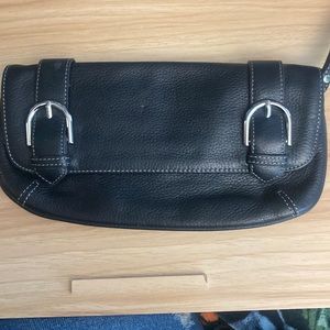 Black clutch like new, has a pink spot on the right hand side in the corner